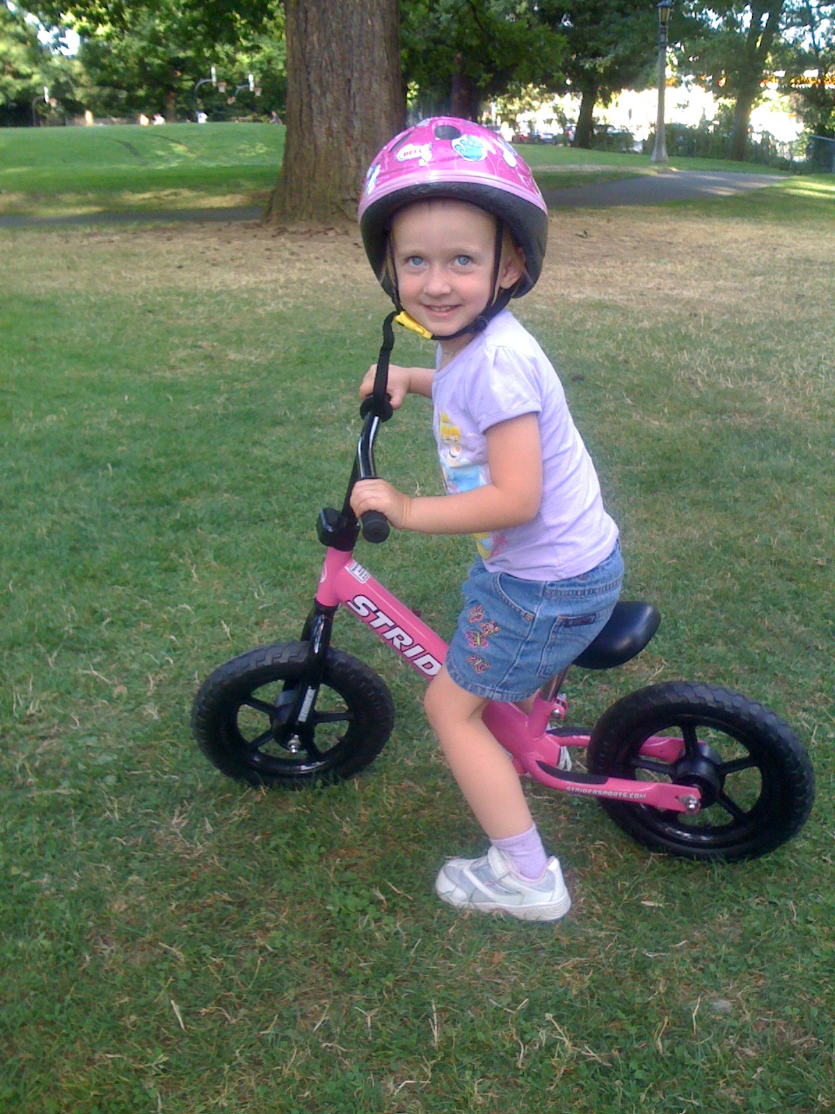 4 year old girl on Strider Running Bike